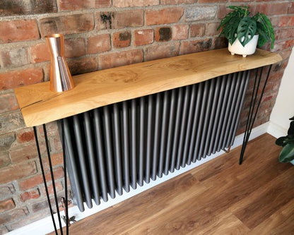 Handcrafted solid oak console table with live edge, black resin filler, and custom sizes. Stylish, bespoke furniture for any room.